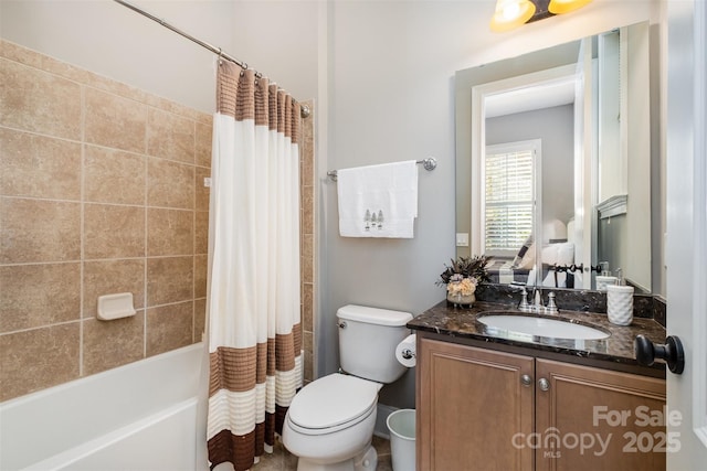 full bathroom featuring vanity, shower / tub combo, and toilet