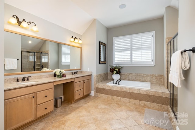 bathroom with separate shower and tub, plenty of natural light, vanity, and tile patterned flooring