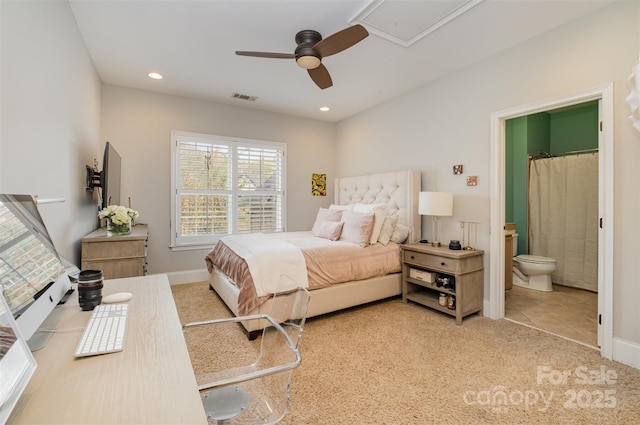 carpeted bedroom featuring connected bathroom and ceiling fan