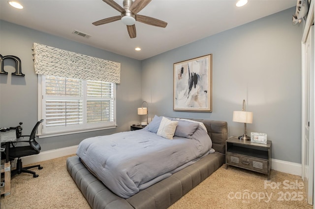 bedroom featuring ceiling fan and light carpet