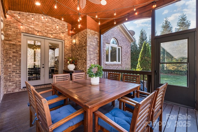 sunroom / solarium featuring wooden ceiling and french doors