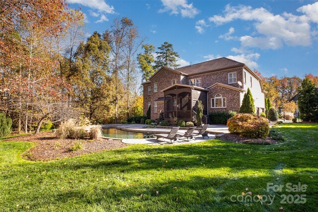 exterior space featuring a front lawn and a sunroom