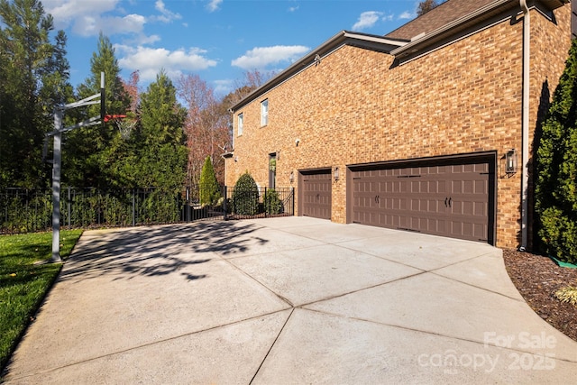 view of side of home featuring a garage