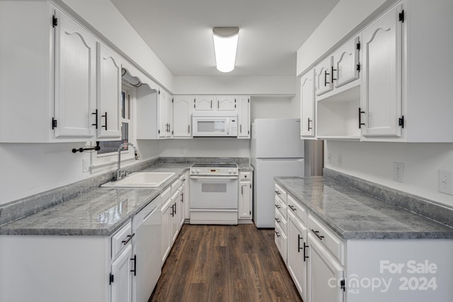 kitchen featuring white cabinetry, sink, dark hardwood / wood-style floors, and white appliances