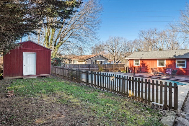 view of yard featuring a patio area and a storage unit