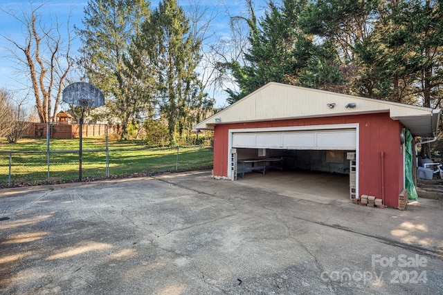 garage with a lawn