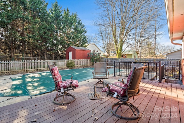 wooden deck featuring a storage shed