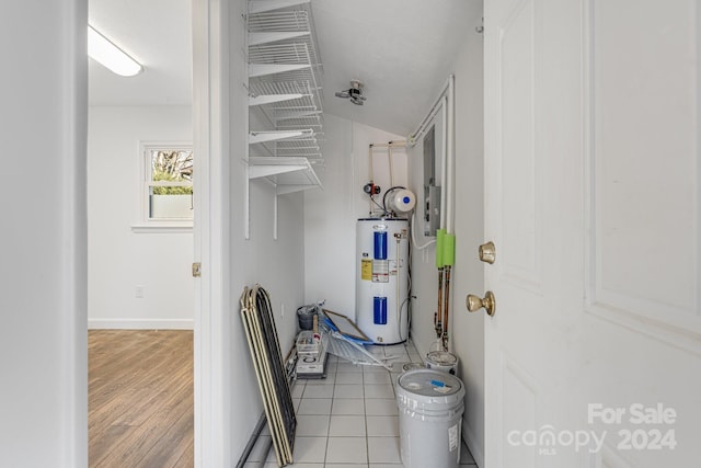 utility room with electric water heater