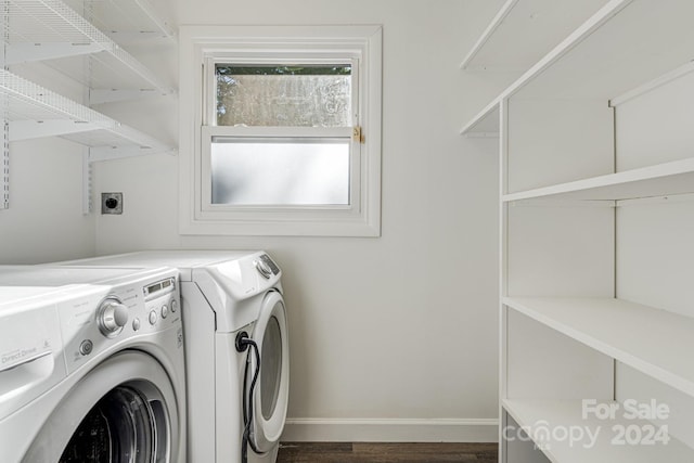 laundry area featuring washer and clothes dryer and dark wood-type flooring