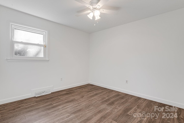 unfurnished room featuring hardwood / wood-style flooring and ceiling fan