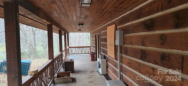 wooden terrace with a porch