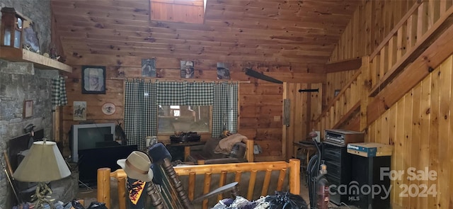 interior space with wooden walls and lofted ceiling