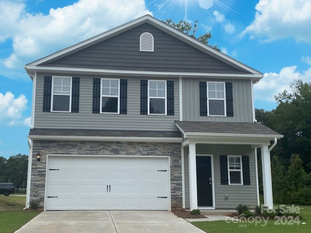 view of front of property with a garage