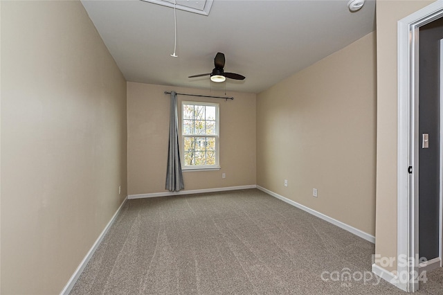 spare room with ceiling fan and carpet floors