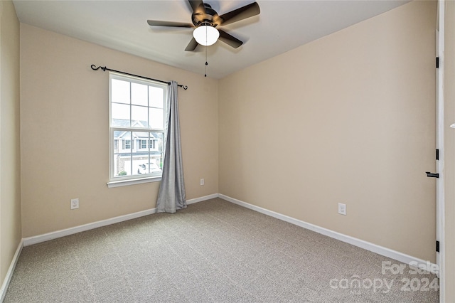 unfurnished room featuring carpet and ceiling fan