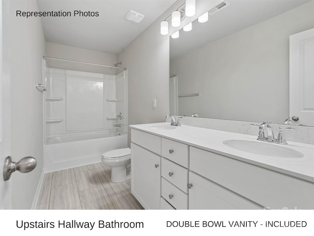 full bathroom featuring vanity, toilet, and shower / washtub combination