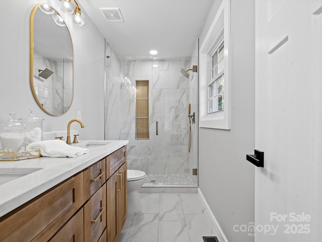 bathroom featuring vanity, toilet, and an enclosed shower