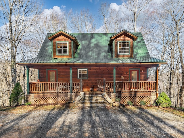 log-style house featuring a porch