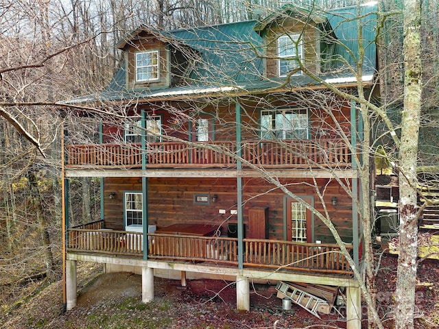 exterior space featuring a balcony and covered porch