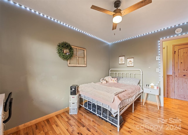 bedroom featuring ceiling fan and light hardwood / wood-style floors