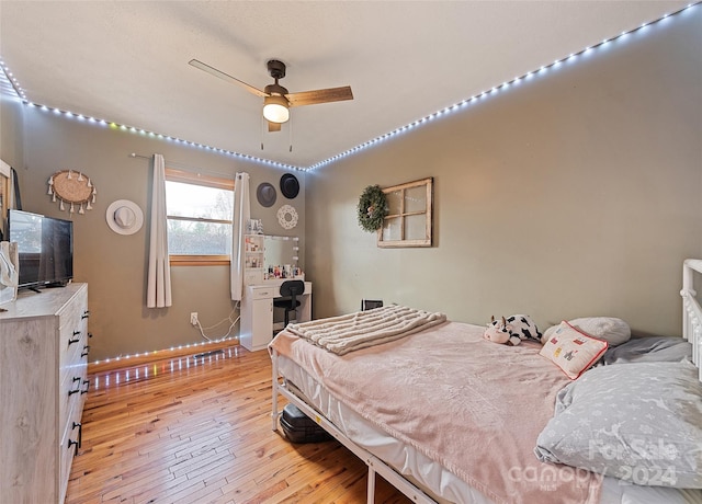 bedroom featuring light hardwood / wood-style floors and ceiling fan