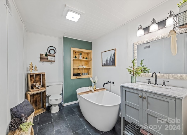 bathroom with a bathing tub, tile patterned flooring, vanity, and toilet