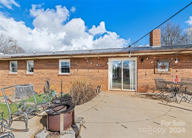 back of property with a patio and central AC