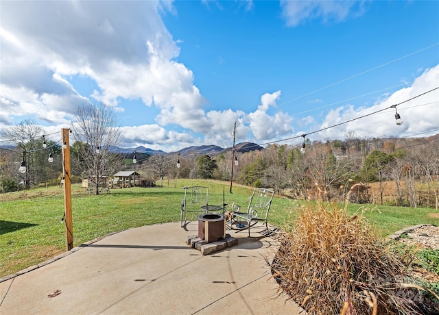 view of patio featuring a mountain view and a rural view