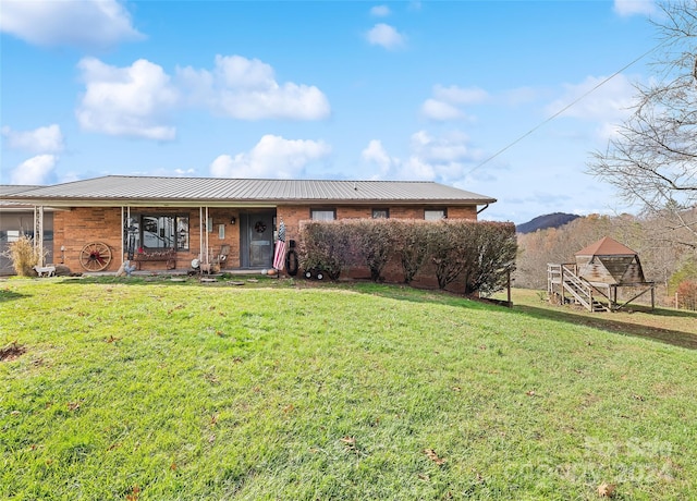 ranch-style home featuring a front yard