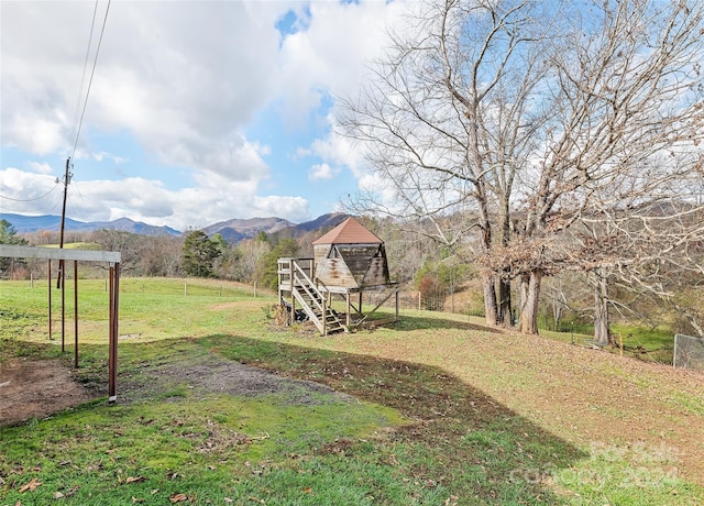 view of yard featuring a mountain view and a rural view