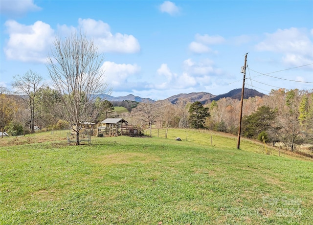 view of yard featuring a mountain view and a rural view