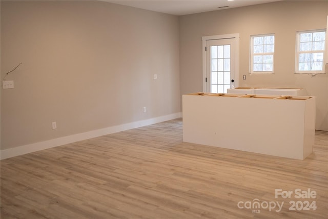 spare room featuring light hardwood / wood-style flooring