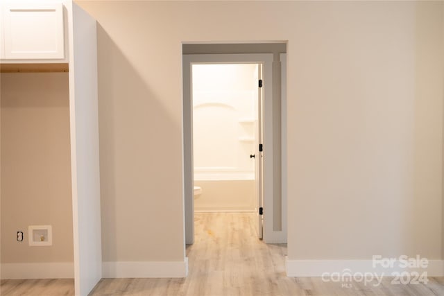 hall with light hardwood / wood-style floors