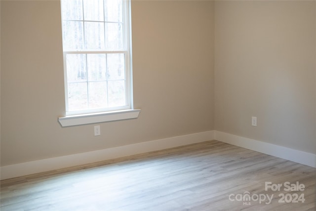 unfurnished room featuring light hardwood / wood-style flooring