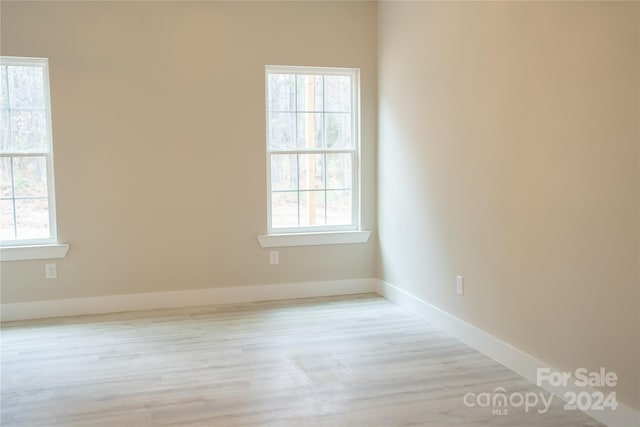 spare room with light wood-type flooring