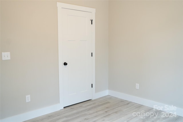 spare room featuring light hardwood / wood-style floors