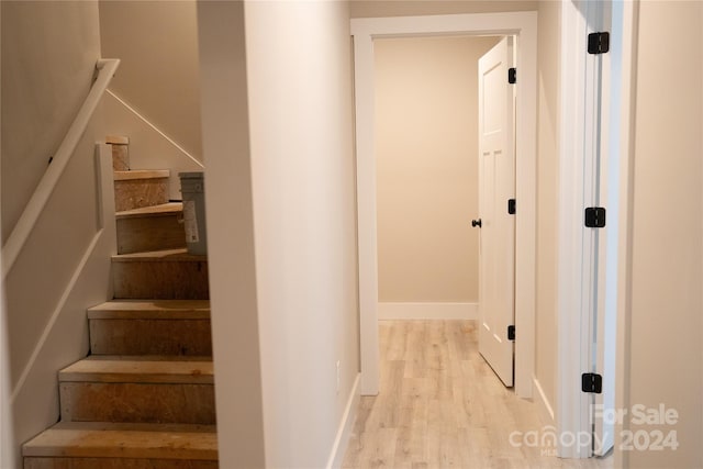 staircase featuring hardwood / wood-style floors