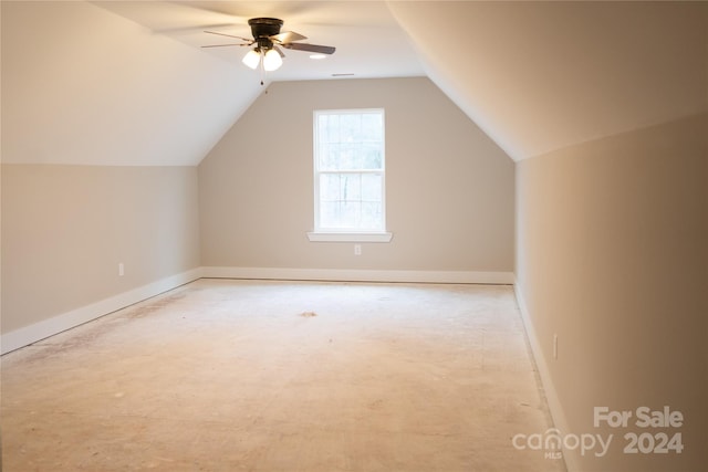 additional living space featuring ceiling fan and vaulted ceiling