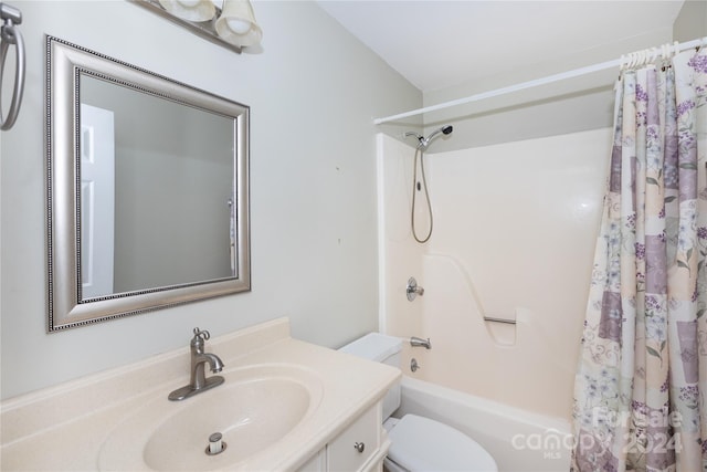 full bathroom with shower / bathtub combination with curtain, vanity, and toilet