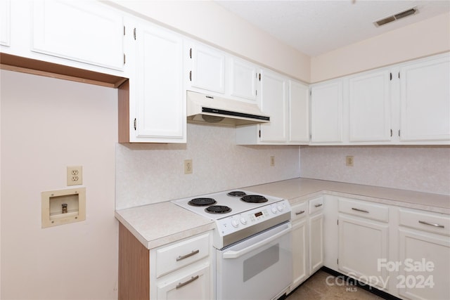 kitchen with white cabinetry and electric range