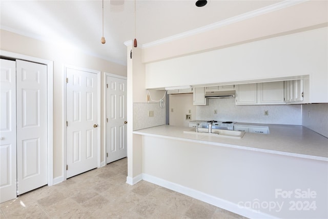 kitchen featuring ornamental molding, sink, light tile patterned floors, and tasteful backsplash