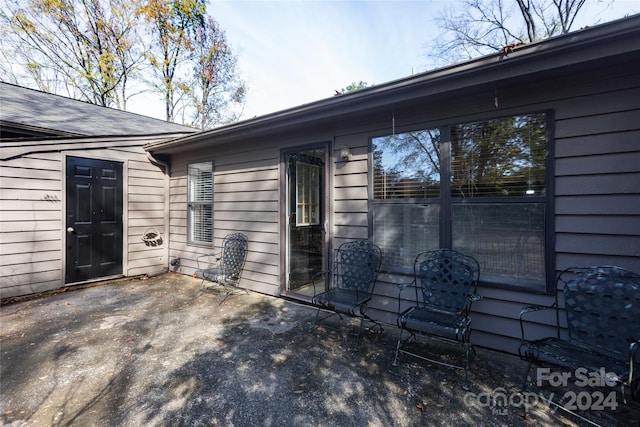 view of side of property featuring a patio