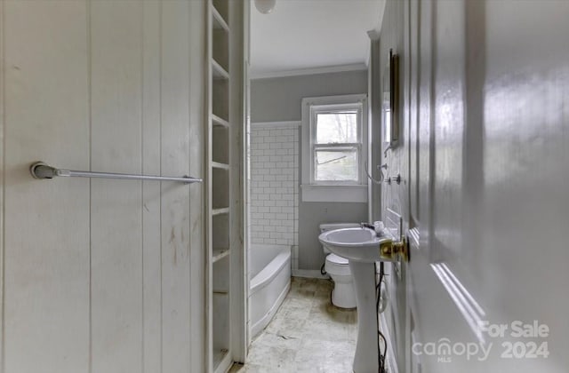 bathroom with toilet and crown molding