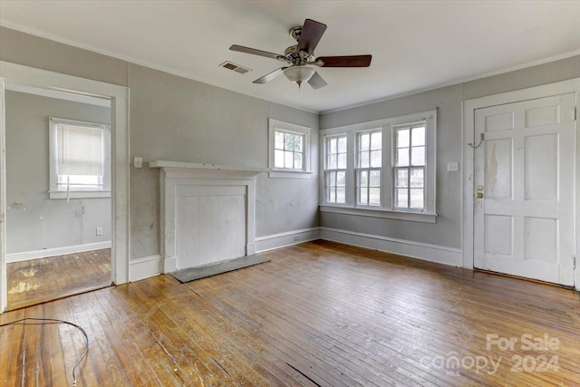 interior space with hardwood / wood-style flooring, a wealth of natural light, and ceiling fan