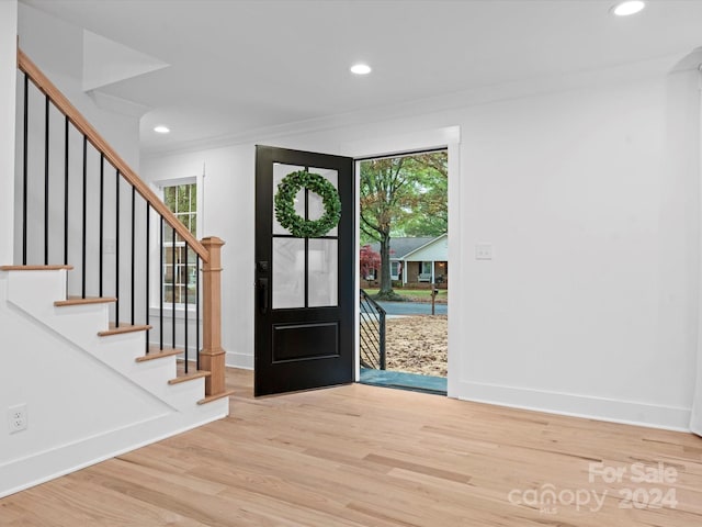 foyer entrance with hardwood / wood-style floors