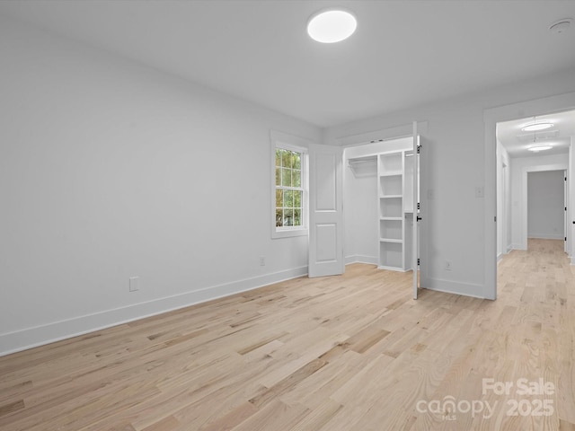 unfurnished bedroom featuring light wood-type flooring