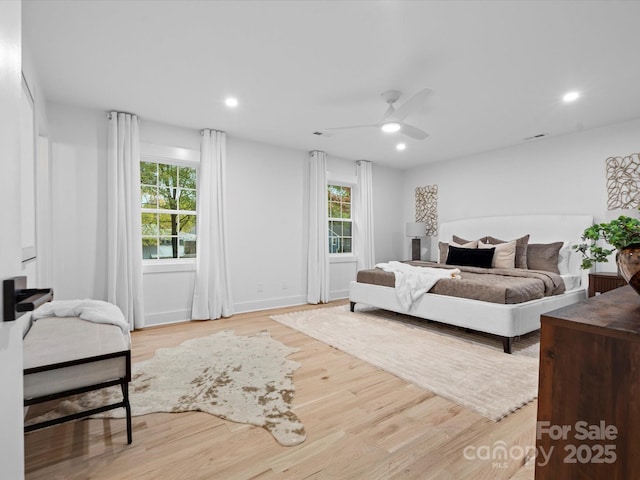 bedroom featuring light hardwood / wood-style floors and ceiling fan