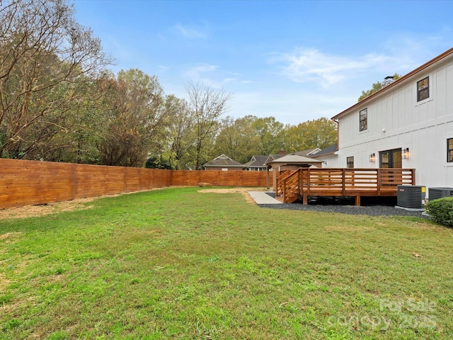 view of yard with a wooden deck, a gazebo, and central air condition unit