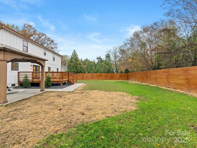 view of yard with a wooden deck