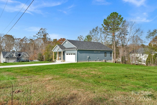 view of front of home featuring a garage and a front yard